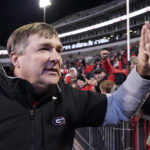
              Georgia head coach Kirby Smart reaches out to give a fan a high-five after his team defeated Mississippi State in an NCAA college football game in Starkville, Miss., Saturday, Nov. 12, 2022. (AP Photo/Rogelio V. Solis)
            