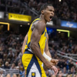 
              Indiana Pacers guard Bennedict Mathurin (00) reacts after being fouled while scoring during the second half of an NBA basketball game against the Brooklyn Nets in Indianapolis, Friday, Nov. 25, 2022. (AP Photo/Doug McSchooler)
            