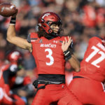 
              Cincinnati quarterback Evan Prater (3) throws a pass during the first half of an NCAA college football game against Tulane, Friday, Nov. 25, 2022, in Cincinnati. (AP Photo/Aaron Doster)
            