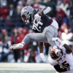 
              Washington State running back Nakia Watson (25) leaps and is tripped up by Arizona State defensive back Chris Edmonds (5) during the first half of an NCAA college football game, Saturday, Nov. 12, 2022, in Pullman, Wash. (AP Photo/Young Kwak)
            