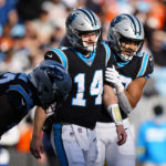 Carolina Panthers quarterback Sam Darnold (14) celebrates after scoring during the second half of an NFL football game between the Carolina Panthers and the Denver Broncos on Sunday, Nov. 27, 2022, in Charlotte, N.C. (AP Photo/Jacob Kupferman)