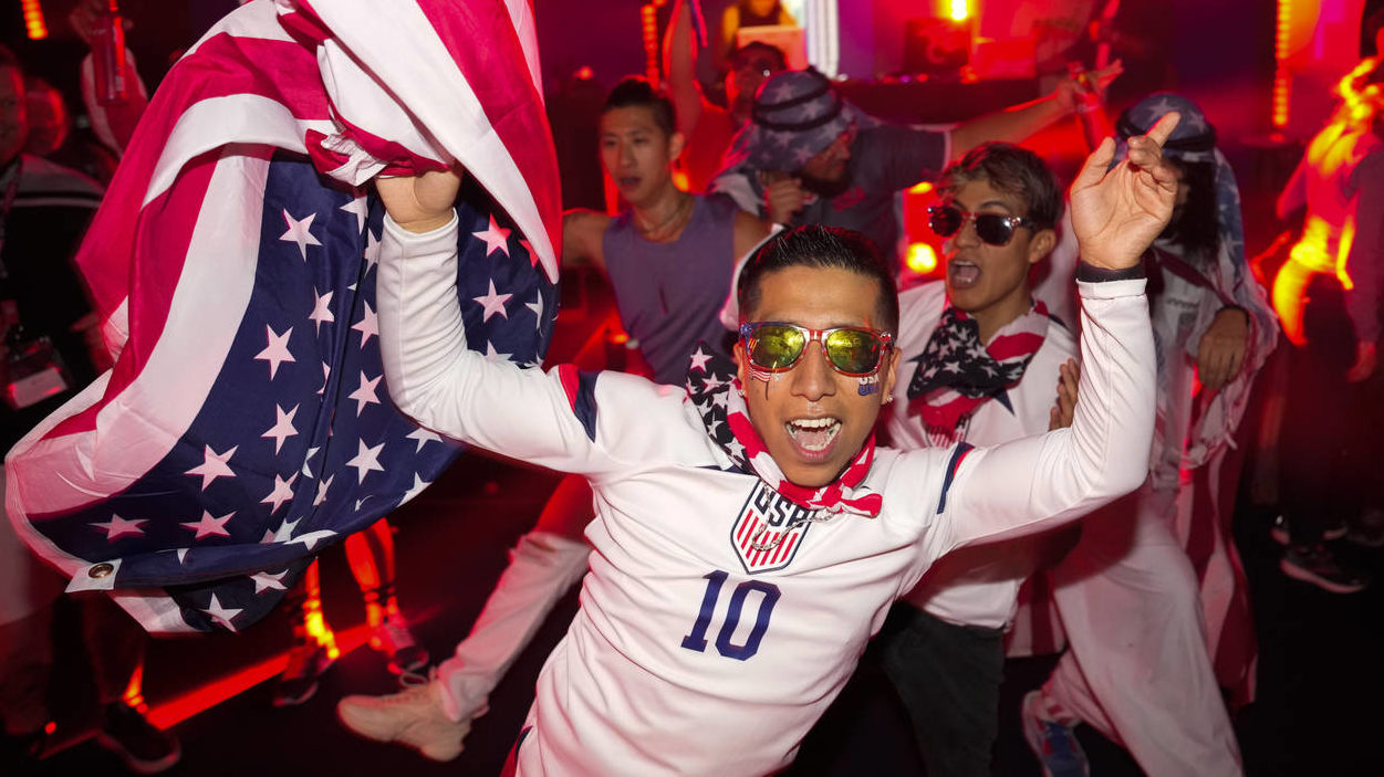 People dance during an official U.S. Soccer fan party at the Budweiser World Club ahead of a FIFA W...