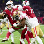 Kevin Givens #90 of the San Francisco 49ers sacks Colt McCoy #12 of the Arizona Cardinals during the third quarter at Estadio Azteca on November 21, 2022 in Mexico City, Mexico. (Photo by Sean M. Haffey/Getty Images)