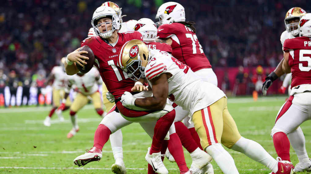 Kevin Givens #90 of the San Francisco 49ers sacks Colt McCoy #12 of the Arizona Cardinals during th...