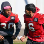 Arizona Cardinals RBs James Conner and Keaontay Ingram warm up ahead of practice on Thursday, Dec. 22, 2022, in Tempe. (Tyler Drake/Arizona Sports)