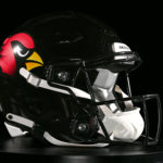 July: The Arizona Cardinals  unveiled an alternate black helmet  that featured a glossy black shell with red flecks, iridescent chrome decals with a gradient screen of the team’s Cardinal head logo. (Arizona Cardinals Photo)