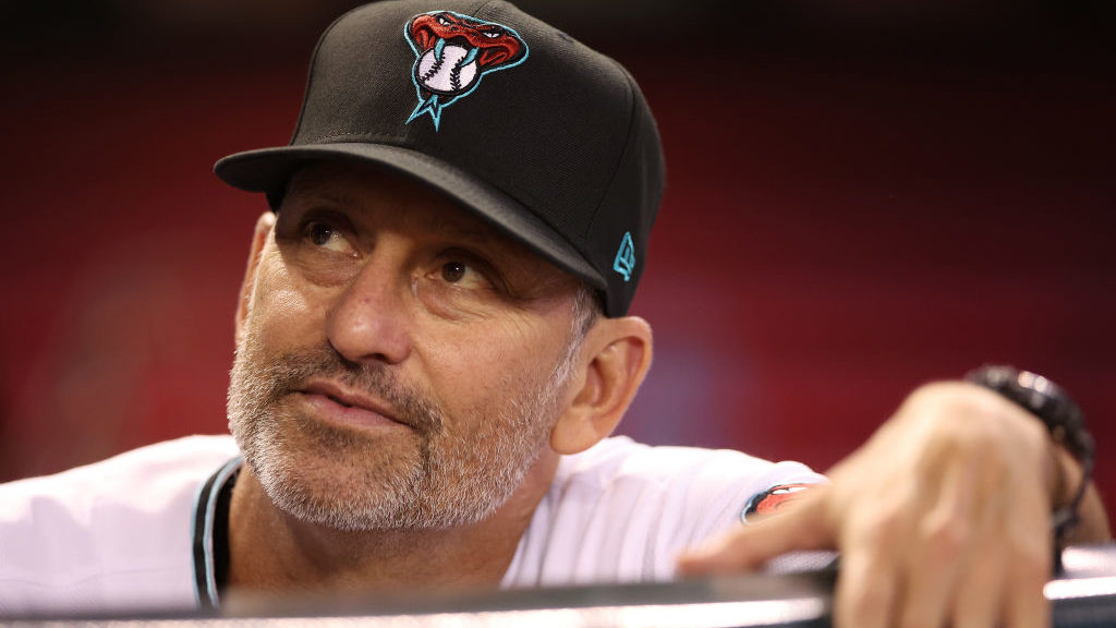 Manager Torey Lovullo #17 of the Arizona Diamondbacks looks up from the dugout before the MLB game ...