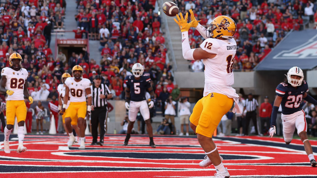 Tight end Jalin Conyers #12 of the Arizona State Sun Devils catches a four-yard touchdown reception...