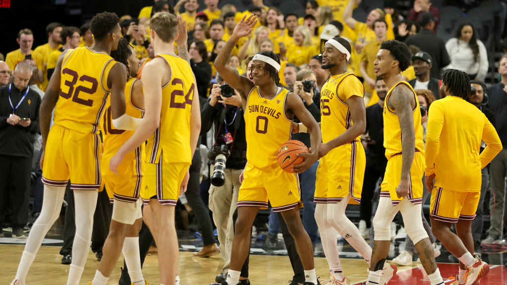 The Arizona State Sun Devils, including DJ Horne #0, celebrate on the court after the team's 73-71 ...