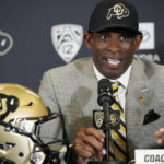 
              Deion Sanders speaks after being introduced as the new head NCAA college football coach at Colorado during a news conference Sunday, Dec. 4, 2022, in Boulder, Colo. (AP Photo/David Zalubowski)
            