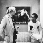 
              FILE - Artist Andy Warhol, left, chats wth soccer superstar Pele about a portrait he is making of him, July 26, 1977, New York. In background is a poster with a photograph of Pele in action. Warhol has been commissioned to make a series of portraits of athletic stars. (AP Photo/Claudia Larson, File)
            
