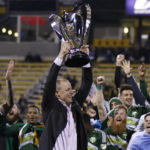 
              FILE - Portland Timbers owner Merritt Paulson raises the trophy after the Timbers defeated the Columbus Crew 2-1 in the MLS Cup championship soccer game Sunday, Dec. 6, 2015, in Columbus, Ohio. Merritt Paulson, also the owner of the Portland Thorns, announced Thursday, Dec. 1, 2022, he is putting the club up for sale, the latest fallout from an investigation into misconduct in the National Women’s Soccer League.(AP Photo/Paul Vernon, Fifle)
            