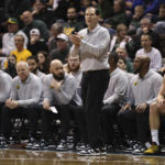 
              Baylor head coach Scott Drew, center, talks to his team on the floor during the first half of an NCAA college basketball game against Gonzaga, Friday, Dec. 2, 2022, in Sioux Falls, S.D. (AP Photo/Josh Jurgens)
            