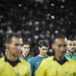 
              Morocco and DR Congo players walk at the beginning of the the soccer playoff match in World Cup 2022 Africa qualifiers, in Casablanca, Morocco, Tuesday, Mar 29, 2022. (AP Photo/Mosa'ab Elshamy)
            