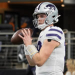 Kansas State quarterback Will Howard (18) throws before the Big 12 Conference championship NCAA college football game against TCU, Saturday, Dec. 3, 2022, in Arlington, Texas. (AP Photo/Mat Otero)
