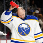Buffalo Sabres goalie Craig Anderson (41) pours water on his head before an NHL hockey game against the Arizona Coyotes, Saturday, Dec. 17, 2022, in Tempe, Ariz. (AP Photo/Darryl Webb)