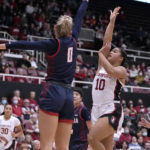 Stanford guard Talana Lepolo (10) shoots over Gonzaga guard Esther Little (0) during the first half of an NCAA college basketball game in Stanford, Calif., Sunday, Dec. 4, 2022. (AP Photo/Tony Avelar)