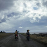 
              Rapanui Konturi Atan, a 36-year-old historian, right, drives his motorbike to a training session for the Hoki Mai challenge, a canoe voyage — covering almost 500 kilometers, or about 300 miles across a stretch of the Pacific Ocean, in Rapa Nui, a territory in the Pacific that is part of Chile and is better known as Easter Island, Thursday, Nov. 24, 2022.  Atan joined the Hoki Mai crew who have been training since mid-September, preparing for a three-day voyage that will take them from Rapa Nui to Motu Motiro Hiva. (AP Photo/Esteban Felix)
            