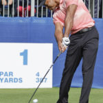 
              Tiger Woods hits off the first tee during the first round of the PNC Championship golf tournament Saturday, Dec. 17, 2022, in Orlando, Fla. (AP Photo/Kevin Kolczynski)
            