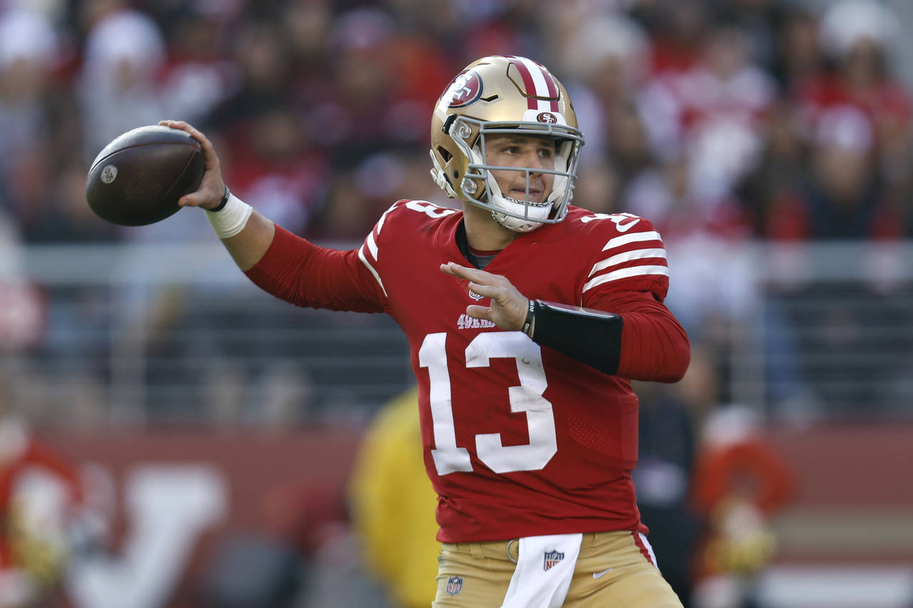 San Francisco 49ers quarterback Brock Purdy throws to a receiver in the first half of an NFL footba...