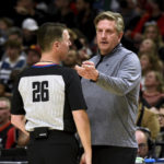 
              Minnesota Timberwolves coach Chris Finch, right, speaks with referee Pat Fraher during the first half of the team's NBA basketball game against the Portland Trail Blazers in Portland, Ore., Saturday, Dec. 10, 2022. (AP Photo/Steve Dykes)
            
