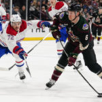 Arizona Coyotes' Jakob Chychrun (6) prepares to shoot as Montreal Canadiens' Arber Xhekaj (72) closes in on him in the first period during an NHL hockey game, Monday, Dec. 19, 2022, in Tempe, Ariz. (AP Photo/Darryl Webb)