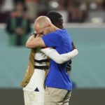
              Head coach Gregg Berhalter of the United States, right, hugs his player Tim Weah after the World Cup round of 16 soccer match between the Netherlands and the United States, at the Khalifa International Stadium in Doha, Qatar, Saturday, Dec. 3, 2022. The Netherlands won 3-1. (AP Photo/Martin Meissner)
            
