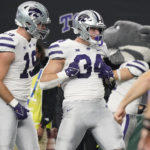 Kansas State tight end Ben Sinnott (34) and tight end Sammy Wheeler (19) celebrate Sinnott's touchdown in the first half of the Big 12 Conference championship NCAA college football game against TCU, Saturday, Dec. 3, 2022, in Arlington, Texas. (AP Photo/LM Otero)