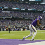 Minnesota Vikings wide receiver K.J. Osborn catches a 2-yard touchdown pass ahead of Indianapolis Colts cornerback Stephon Gilmore (5) during the second half of an NFL football game, Saturday, Dec. 17, 2022, in Minneapolis. (AP Photo/Abbie Parr)