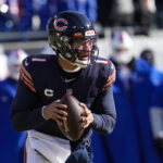 
              Chicago Bears quarterback Justin Fields (1) throws against the Buffalo Bills in the first half of an NFL football game in Chicago, Saturday, Dec. 24, 2022. (AP Photo/Nam Y. Huh)
            