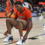 Auburn guard K.D. Johnson (0) reacts after breaking up a play by Memphis during the first-half of an NCAA college basketball game, Saturday, Dec. 10, 2022, in Atlanta. (AP Photo/Erik Rank)