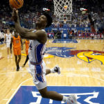 
              Kansas Jayhawks forward K.J. Adams Jr. shoots during the first half of an NCAA college basketball game against Oklahoma State Saturday, Dec. 31, 2022, in Lawrence, Kan. (AP Photo/Charlie Riedel)
            