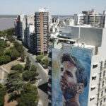 
              A mural of soccer player Lionel Messi covers a building near the Parana River in Rosario, Argentina, Wednesday, Dec. 14, 2022. (AP Photo/Rodrigo Abd)
            