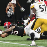 Atlanta Falcons tight end MyCole Pruitt (85) dives into the end zone for a touchdown after a catch against the Pittsburgh Steelers during the second half of an NFL football game, Sunday, Dec. 4, 2022, in Atlanta. (AP Photo/John Bazemore)