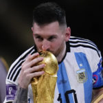 
              Argentina's Lionel Messi kisses the trophy after winning the World Cup final soccer match between Argentina and France at the Lusail Stadium in Lusail, Qatar, Sunday, Dec.18, 2022. (AP Photo/Manu Fernandez)
            