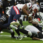 
              New England Patriots running back Kevin Harris (36) is tackled by Las Vegas Raiders cornerback Nate Hobbs (39) during the first half of an NFL football game between the New England Patriots and Las Vegas Raiders, Sunday, Dec. 18, 2022, in Las Vegas. (AP Photo/David Becker)
            