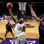 Kansas State guard Desi Sills (13) gets past Abilene Christian forward Cameron Steele (5) to put up a shot during the second half of an NCAA college basketball game Tuesday, Dec. 6, 2022, in Manhattan, Kan. Kansas State won 81-64. (AP Photo/Charlie Riedel)