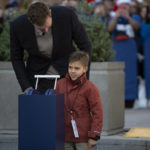 
              Dirk Nowitzki speaks to his son, Max, during the "All Four One" statue ceremony in front of the American Airlines Center in Dallas, Sunday, Dec. 25, 2022. (AP Photo/Emil T. Lippe)
            