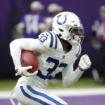 Indianapolis Colts cornerback Dallis Flowers (33) returns a kickoff during the first half of an NFL football game against the Minnesota Vikings, Saturday, Dec. 17, 2022, in Minneapolis. (AP Photo/Andy Clayton-King)