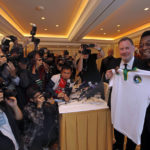 
              FILE - Brazilian soccer great Pele poses with Paul Kemsley, second right, chairman of the New York Cosmos, during a press conference in Hong Kong, March 7, 2011. Pele was in here to promote the rebirth of the Cosmos, hoping for the team to begin play in 2014. Pelé, the Brazilian king of soccer who won a record three World Cups and became one of the most commanding sports figures of the last century, died in Sao Paulo on Thursday, Dec. 29, 2022. He was 82.  (AP Photo/Vincent Yu, File)
            