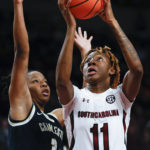 
              South Carolina guard Talaysia Cooper (11) shoots against Charleston Southern guard Jazmine Jackson (3) during the first half of an NCAA college basketball game in Columbia, S.C., Sunday, Dec. 18, 2022. (AP Photo/Nell Redmond)
            