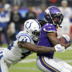 Minnesota Vikings wide receiver K.J. Osborn (17) catches a pass ahead of Indianapolis Colts linebacker Zaire Franklin (44) during the second half of an NFL football game, Saturday, Dec. 17, 2022, in Minneapolis. (AP Photo/Andy Clayton-King)