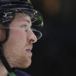 Vancouver Canucks' Brock Boeser waits for a faceoff against the Arizona Coyotes during the first period of an NHL hockey game in Vancouver, British Columbia on Saturday, Dec. 3, 2022. (Darryl Dyck/The Canadian Press via AP)