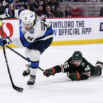 Minnesota Wild's Mats Zuccarello (36) dives at Winnipeg Jets' Axel Jonsson-Fjallby during the second period of an NHL hockey game in Winnipeg, Manitoba, on Tuesday Dec. 27, 2022. (Fred Greenslade/The Canadian Press via AP)