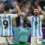 
              Argentina's Lionel Messi, right, congratulates teammate Julian Alvarez after scoring their third goal during the World Cup semifinal soccer match between Argentina and Croatia at the Lusail Stadium in Lusail, Qatar, Tuesday, Dec. 13, 2022. (AP Photo/Petr David Josek)
            