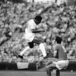 
              FILE - Pele reacts after heading the ball during a soccer match between the Cosmos and the Toronto Metro-Croatia in New York's Downing Stadium,  June 19, 1975. Pelé, the Brazilian king of soccer who won a record three World Cups and became one of the most commanding sports figures of the last century, died in Sao Paulo on Thursday, Dec. 29, 2022. He was 82.  (AP Photo/ Richard Drew, File)
            