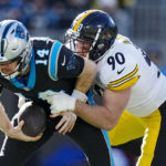 
              Carolina Panthers quarterback Sam Darnold is sacked by Pittsburgh Steelers linebacker T.J. Watt during the first half of an NFL football game between the Carolina Panthers and the Pittsburgh Steelers on Sunday, Dec. 18, 2022, in Charlotte, N.C. (AP Photo/Rusty Jones)
            