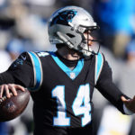 Carolina Panthers quarterback Sam Darnold passes during the first half of an NFL football game between the Carolina Panthers and the Detroit Lions on Saturday, Dec. 24, 2022, in Charlotte, N.C. (AP Photo/Jacob Kupferman)