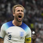 
              England's Harry Kane celebrates after scoring his side's opening goal during the World Cup quarterfinal soccer match between England and France, at the Al Bayt Stadium in Al Khor, Qatar, Saturday, Dec. 10, 2022. (AP Photo/Frank Augstein)
            