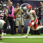
              Kansas City Chiefs running back Jerick McKinnon (1) runs for a touchdown against the Houston Texans during the first half of an NFL football game Sunday, Dec. 18, 2022, in Houston. (AP Photo/Eric Christian Smith)
            